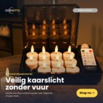 12 genopladelige 3D LED-waxinelys med fjernbetjening og timerfunktion (brændetid op til 400 timer) præsenteres i en åben sort æske - sikker hygge uden ild. "Shop nu"-knap nederst til højre.